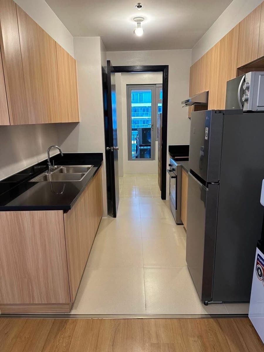 Park Triangle Residences | 2BR Unit + Maid's Room - photo 1