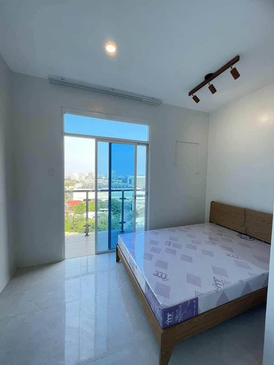 🏡 FOR LONG-TERM RENT — SEMI-FURNISHED CORNER STUDIO UNIT WITH BALCONY - photo 1